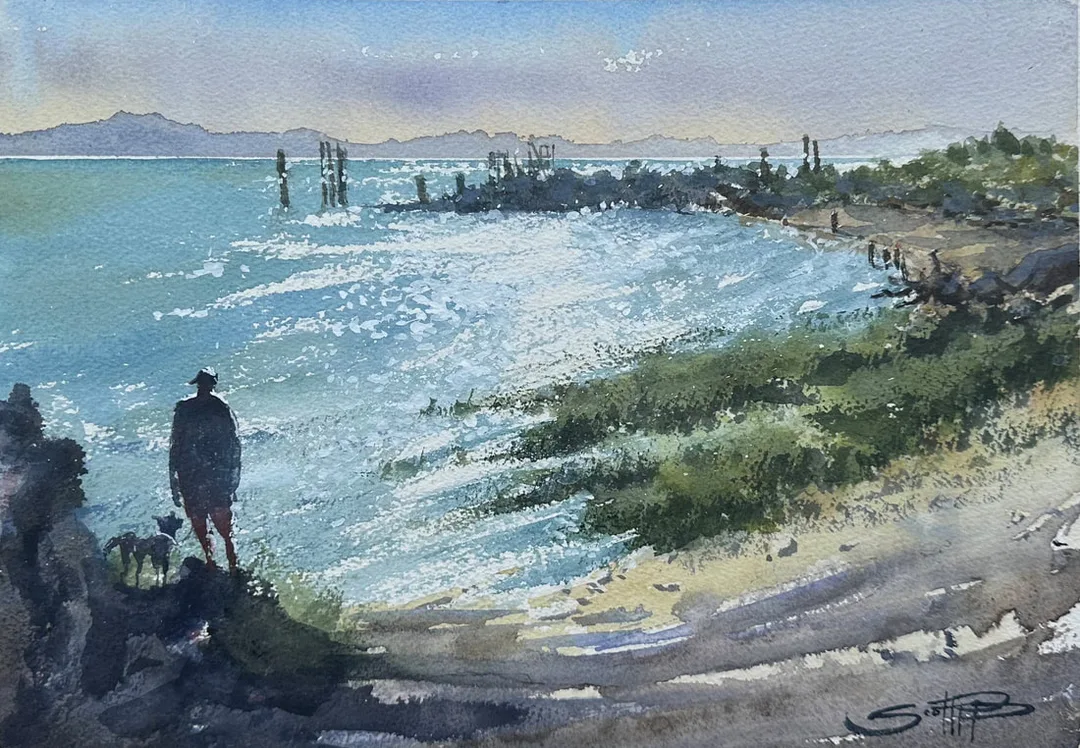 A watercolour painting showing a figure and their dog gazing out at the shimmer of sun on the ocean water at garry point park in Steveston, BC, Canada. The distant Vancouver island are a pale violet and the sky has a layer of yellow and violet from the recent wildfire.