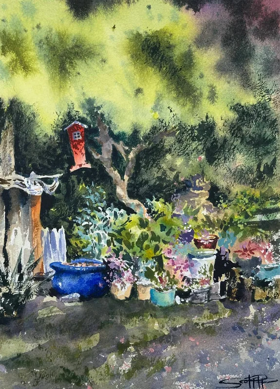 A watercolour painting showing a garden scene, a japanese maple tree in the bright sunlight casts dapples shadows over a hanging red bird house, an array of plants and succulents are at the base of the tree.